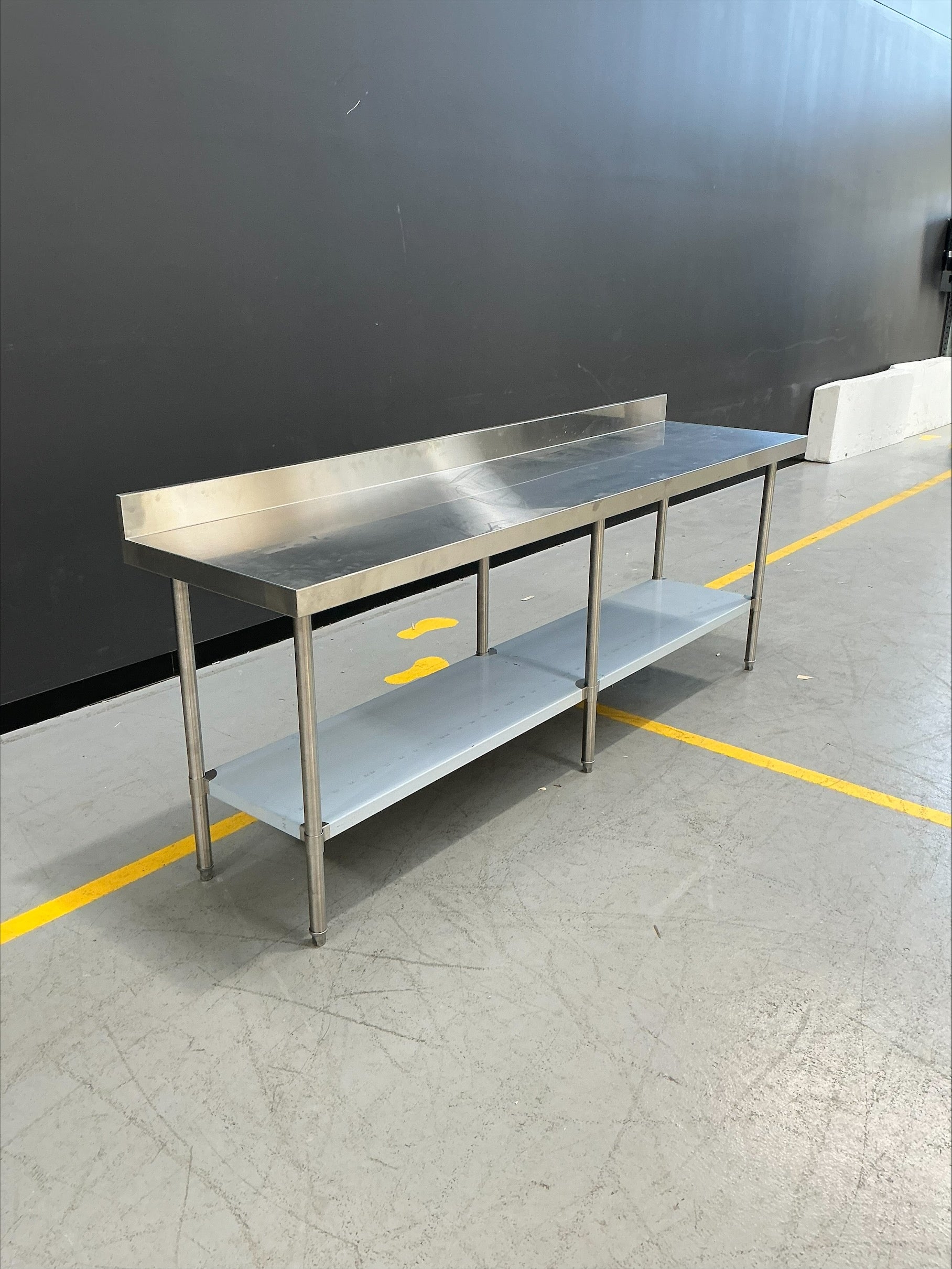 Vogue - DA343 - Premium Stainless Steel Table with Splashback 2400mm